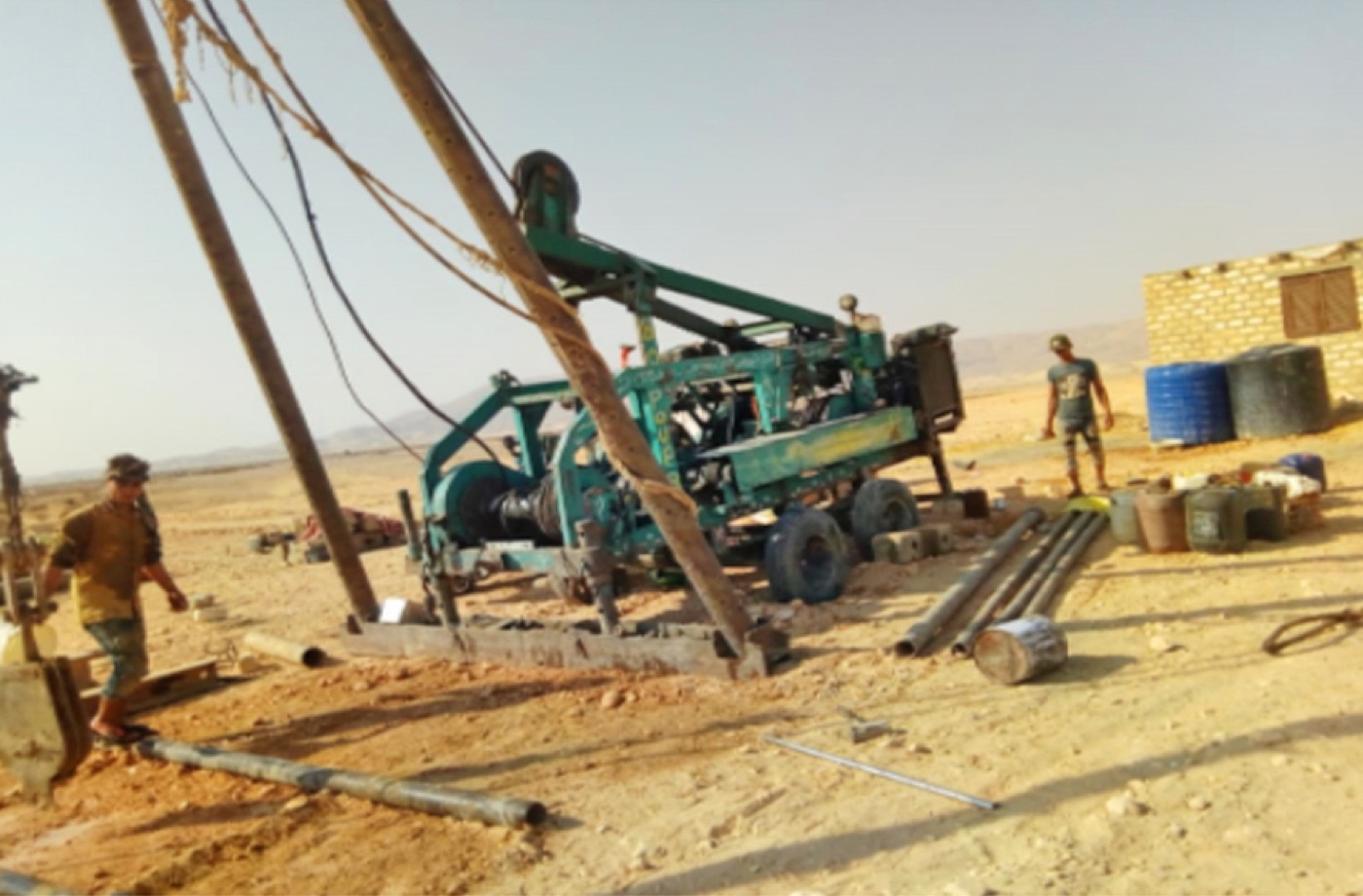 Water well drilling rig working in the desert